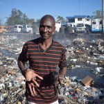 In addition to the depot, Mr. Raymond owns three big pigs, of which one has recently farrowed seven piglets. The animals that he binds to a long leash, roam around in the river and feed themselves on all-sorts of alluvial food waste and trash.